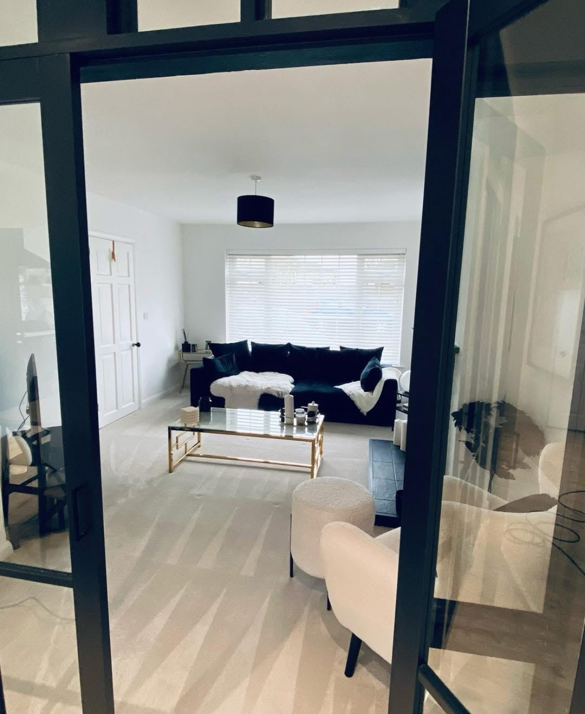 Pristine interior viewed through Crittall doors