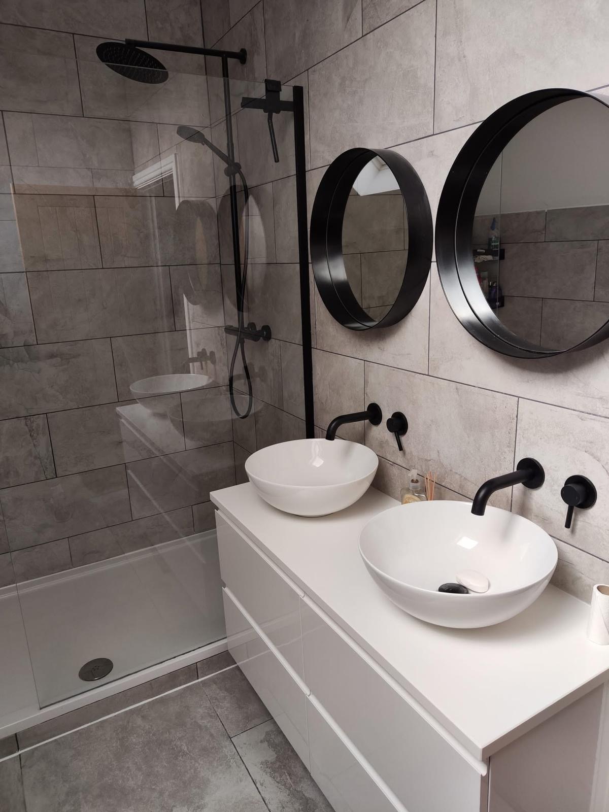 Modern grey bathroom with twin basins and walk-in shower